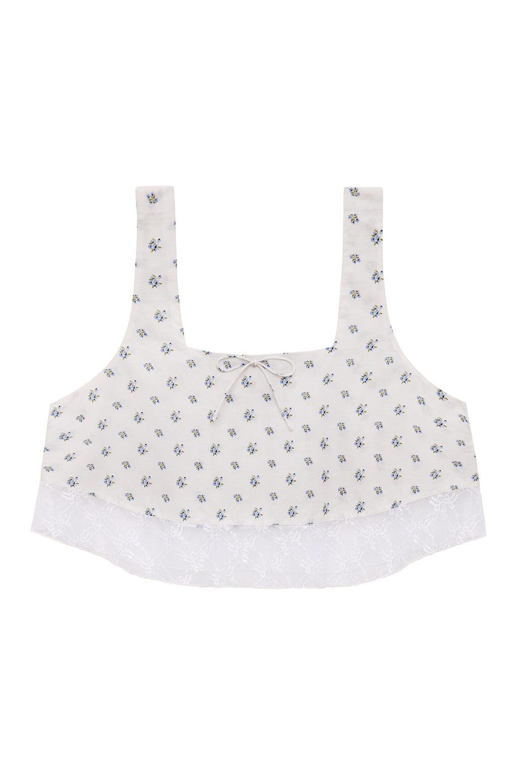 Cream crop top with small blue floral print, square neckline, wide straps, and white lace trim along the hem.