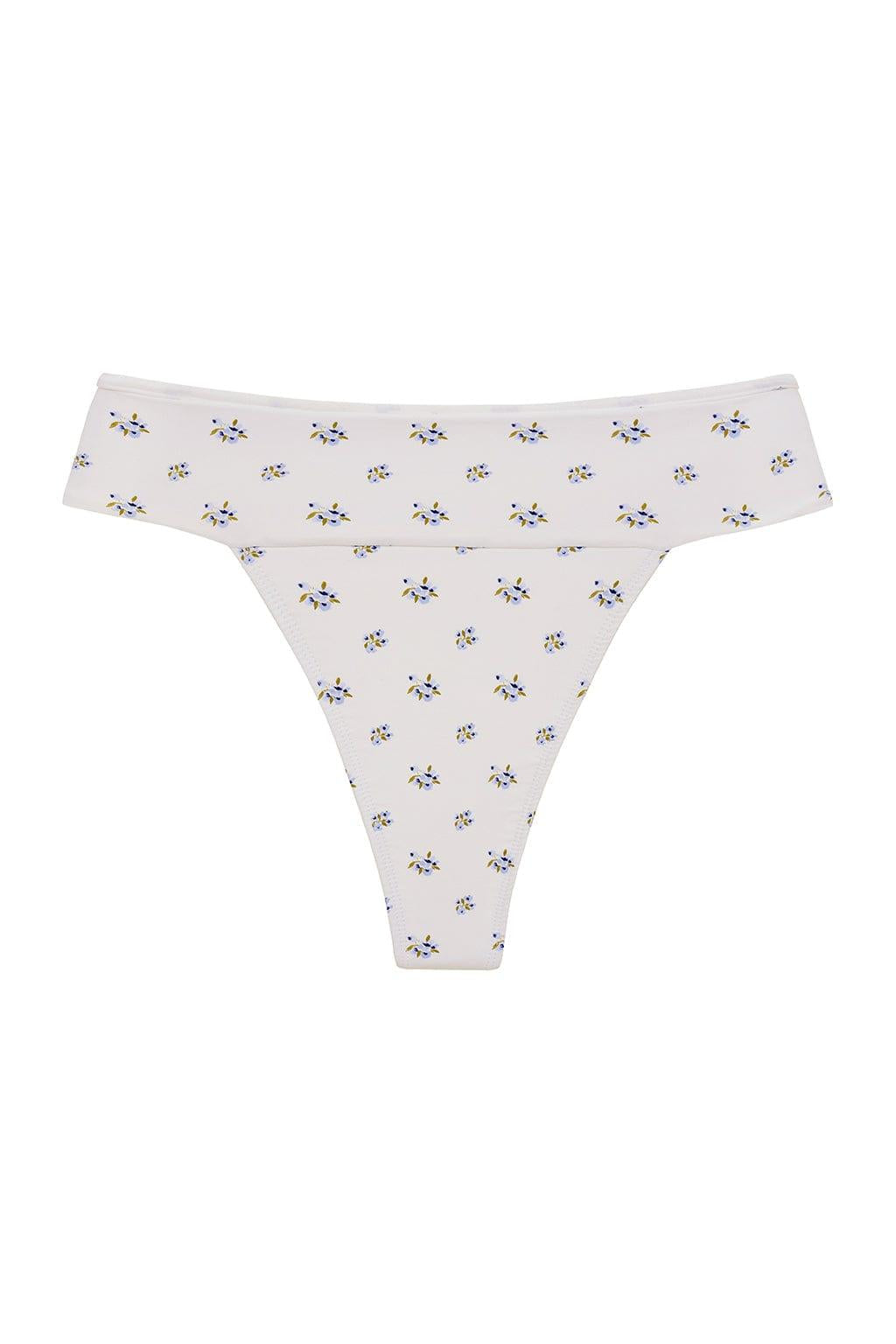 Cream bikini bottom with small scattered blue and yellow floral print throughout.
