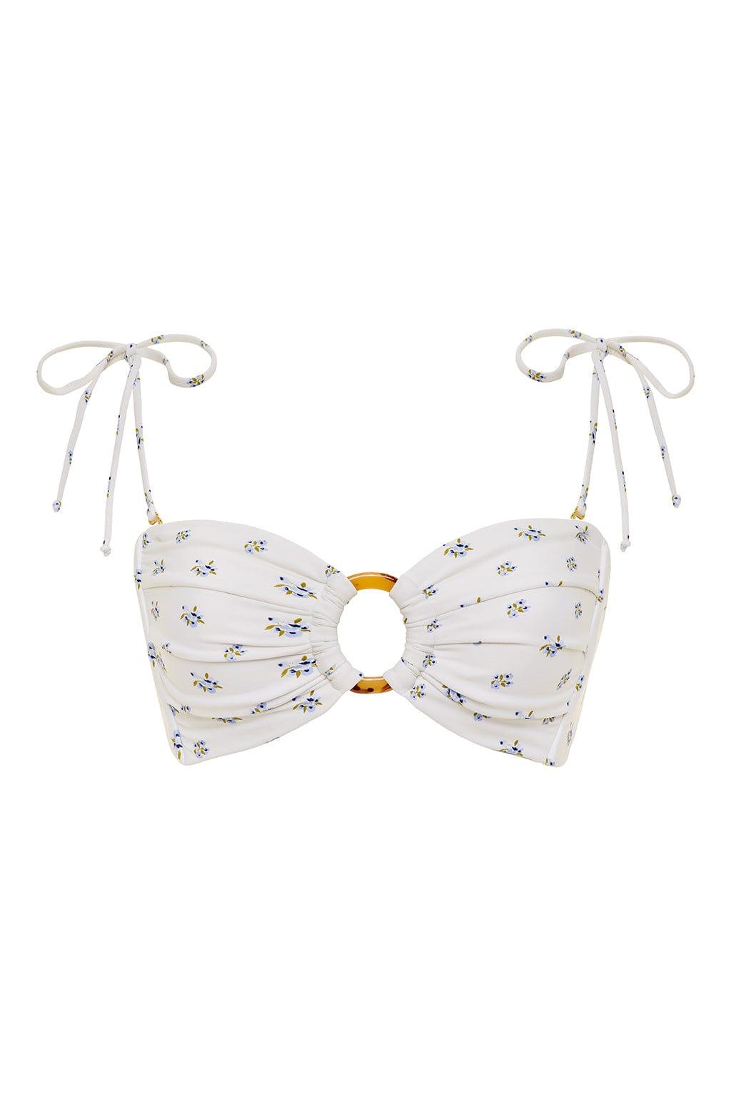 White bandeau bikini top with small multicolored floral print and tortoiseshell ring detail, featuring adjustable neck ties.