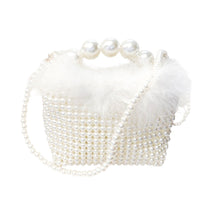 pearl handle pouch bag with fur detail. this bag is perfect to accessorize with any outfit 