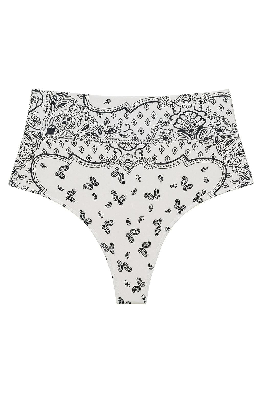 High-rise bikini bottom in cream with black bandana patterning featuring paisley and geometric designs.