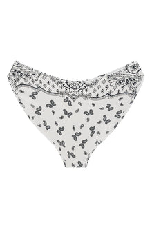 White bikini bottom with black bandana and paisley print pattern throughout and ruched waistband detail.