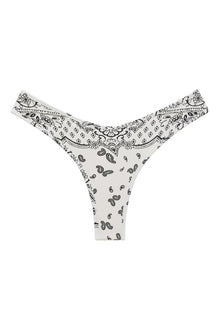 White bikini bottom with black bandana print featuring paisley and geometric patterns throughout.