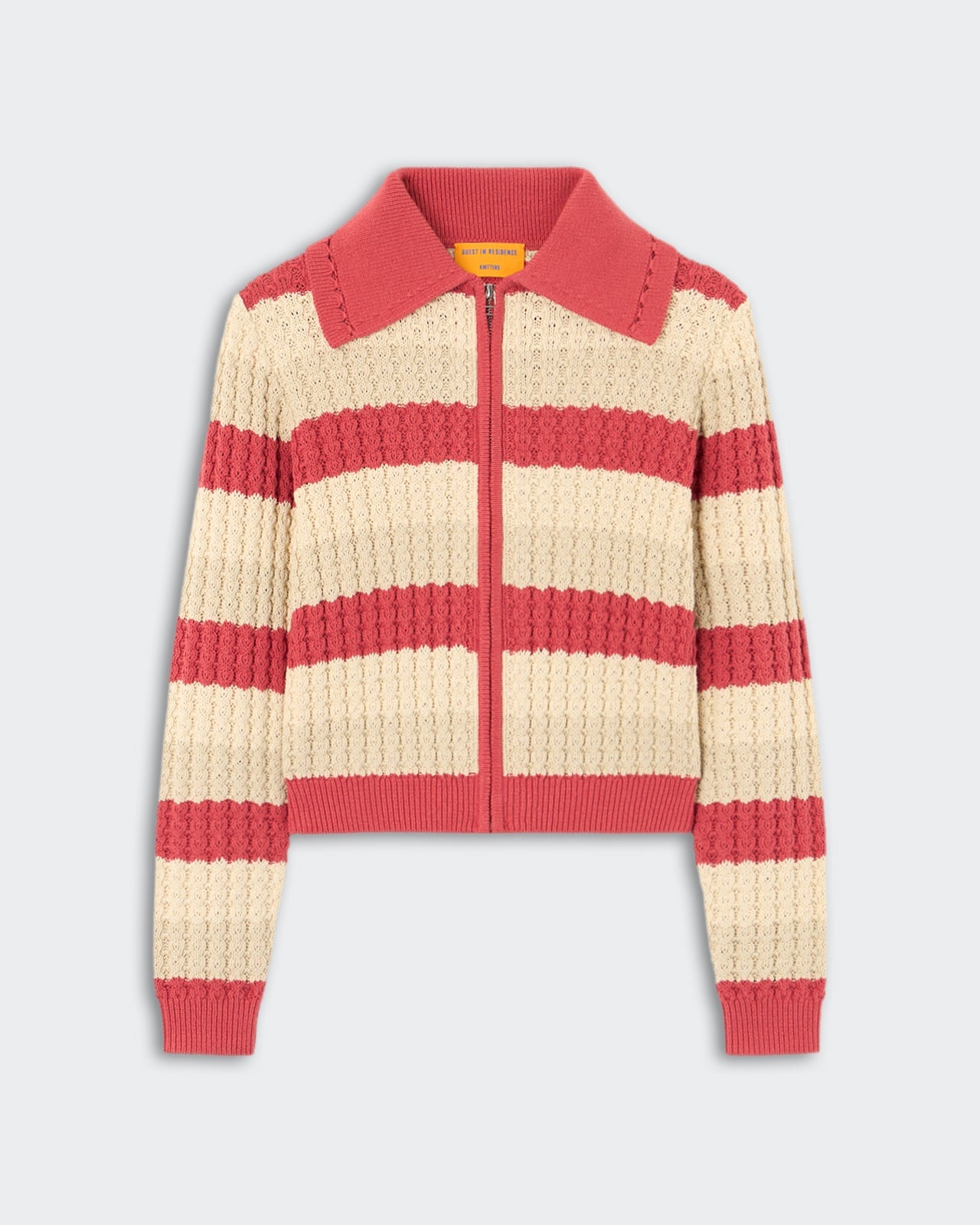 Kirby Jacket - Scarlet Combo, a zip-up knit jacket featuring wide horizontal stripes in soft cream and muted scarlet, textured with a raised cable pattern and finished with a ribbed collar, cuffs, and hem.