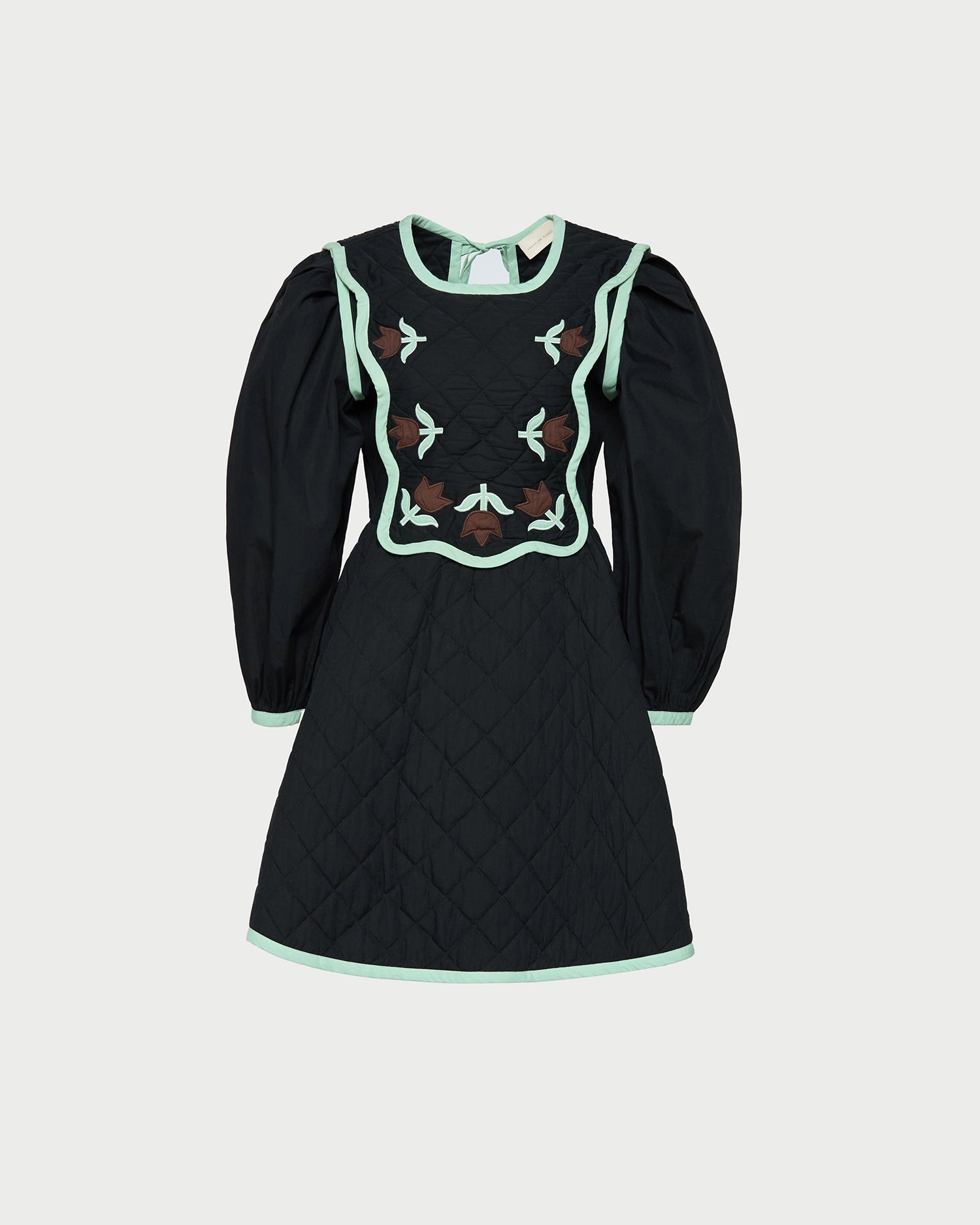 Laney Short Dress in quilted black cotton with mint and brown floral design.