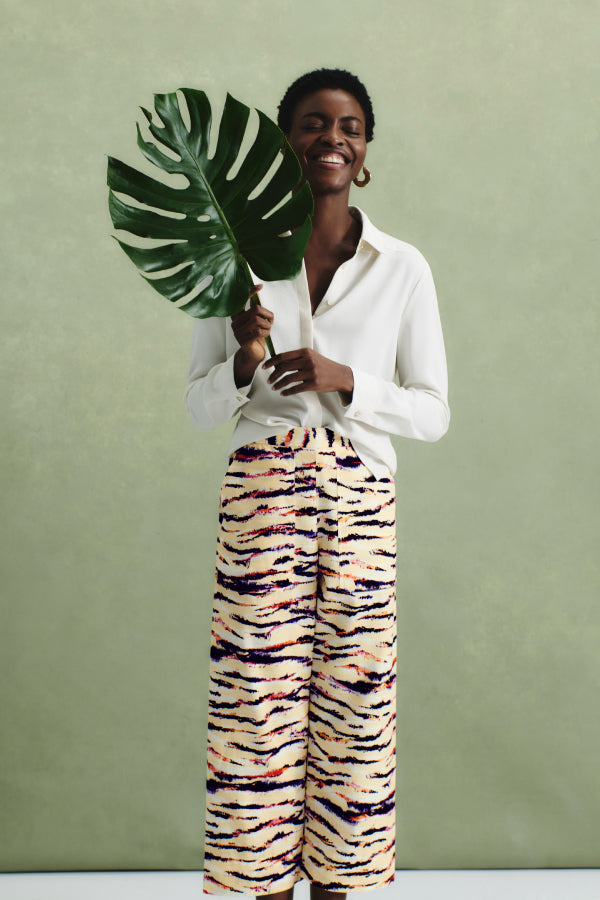 front image of a woman wearing the madelyn pant in savannah print | Exclude | ALT GRID
