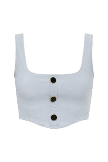 Light blue denim corset top with square neckline, wide shoulder straps, and three black button closures down the front.