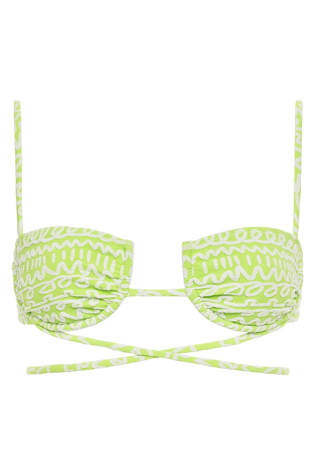 Lime green and white patterned bikini top with ruched cups, thin shoulder straps, and crossover back ties.