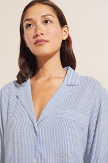 Model is wearing Nautico Long PJ Set in Wedgewood Blue/White.