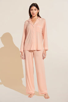 Model is Wearing the Gisele TENCEL Modal Long PJ Set in Peach Parfait/Ivory.