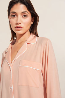 Model is Wearing the Gisele TENCEL Modal Long PJ Set in Peach Parfait/Ivory.