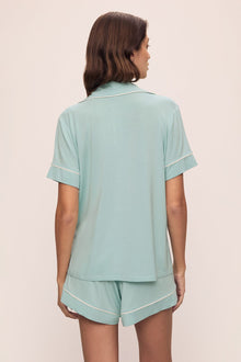 Model is wearing Gisele TENCEL Modal Relaxed Short PJ Set in Canal Blue/Ivory
