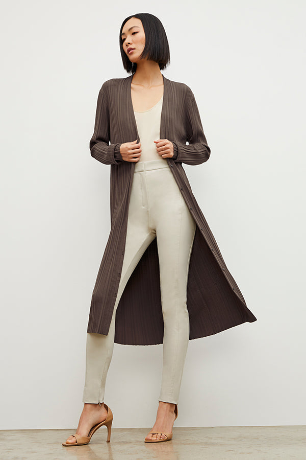 Front image of a woman standing wearing the Curie Pant—Everstretch in Bone | Exclude