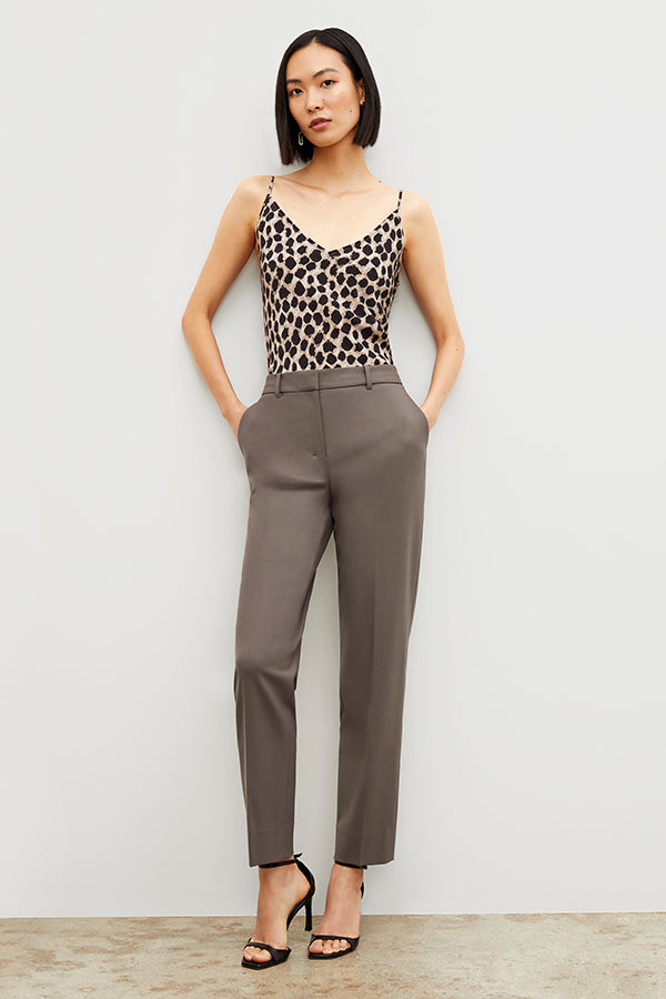 Front image of a woman standing wearing the Lisey Cami—Sahara Print Washable Silk in Tan/Black | Exclude