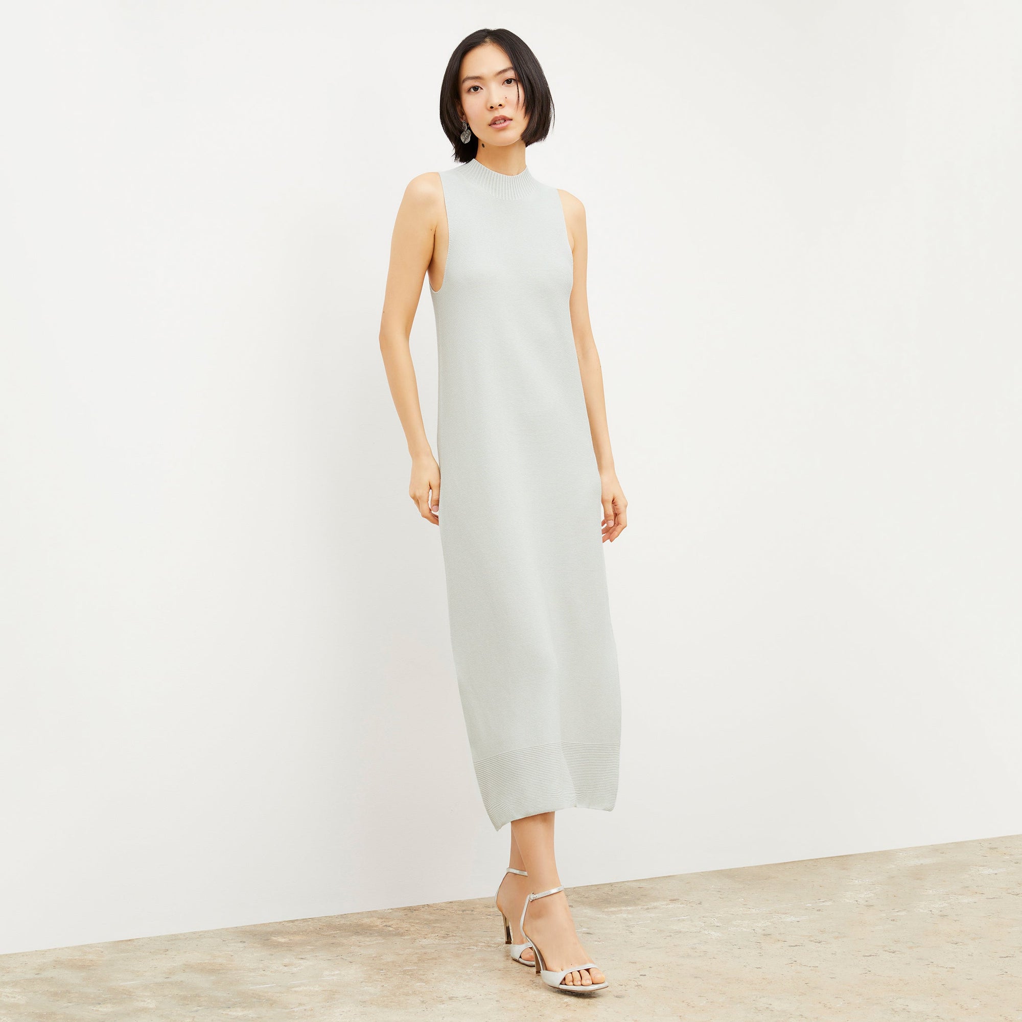 Woman standing wearing the Ella Sandal in Silver