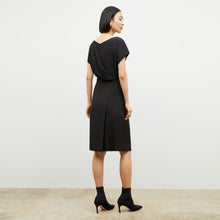 Back image of a woman wearing the jillian dress in black