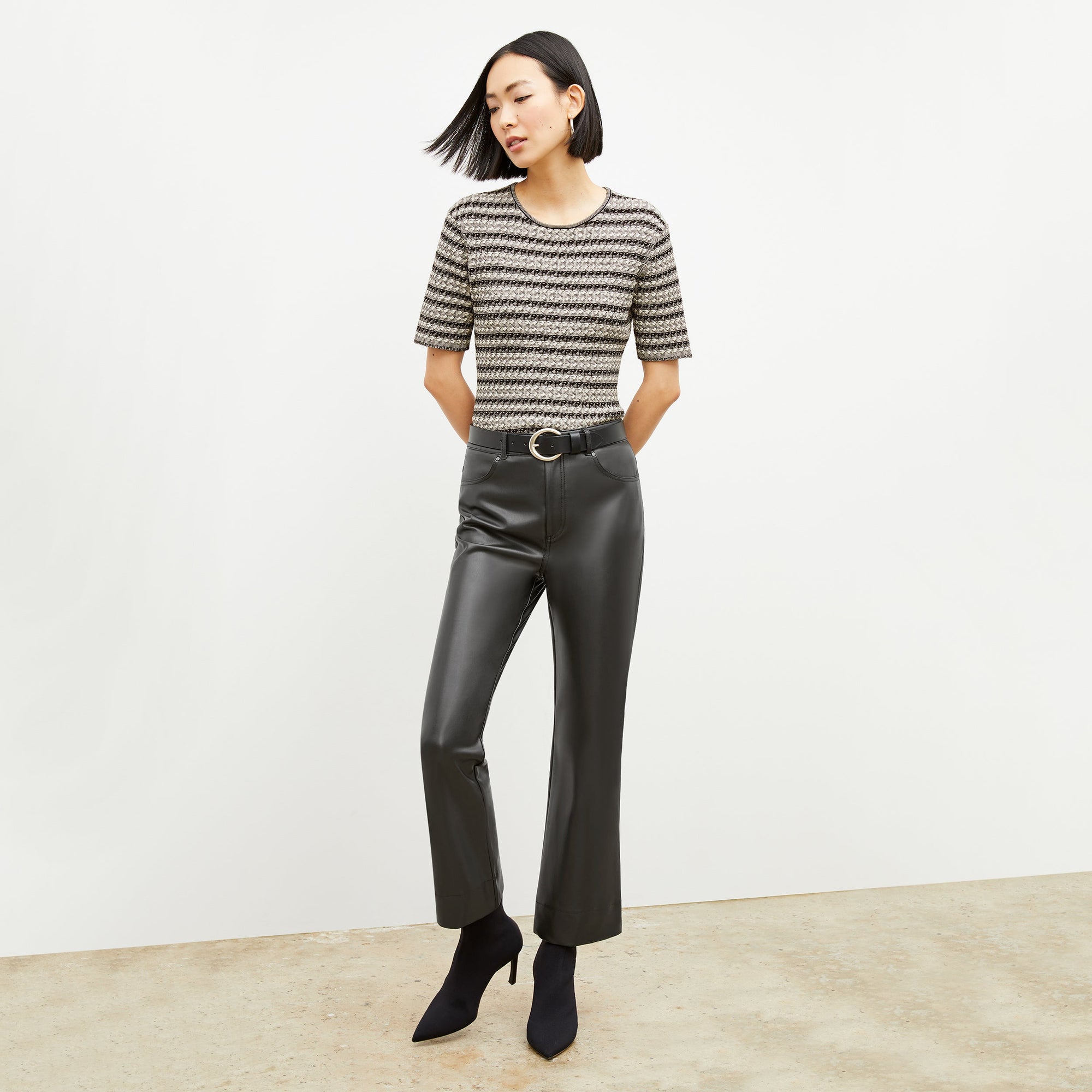 Front image of a woman wearing the archie pant in black | Exclude