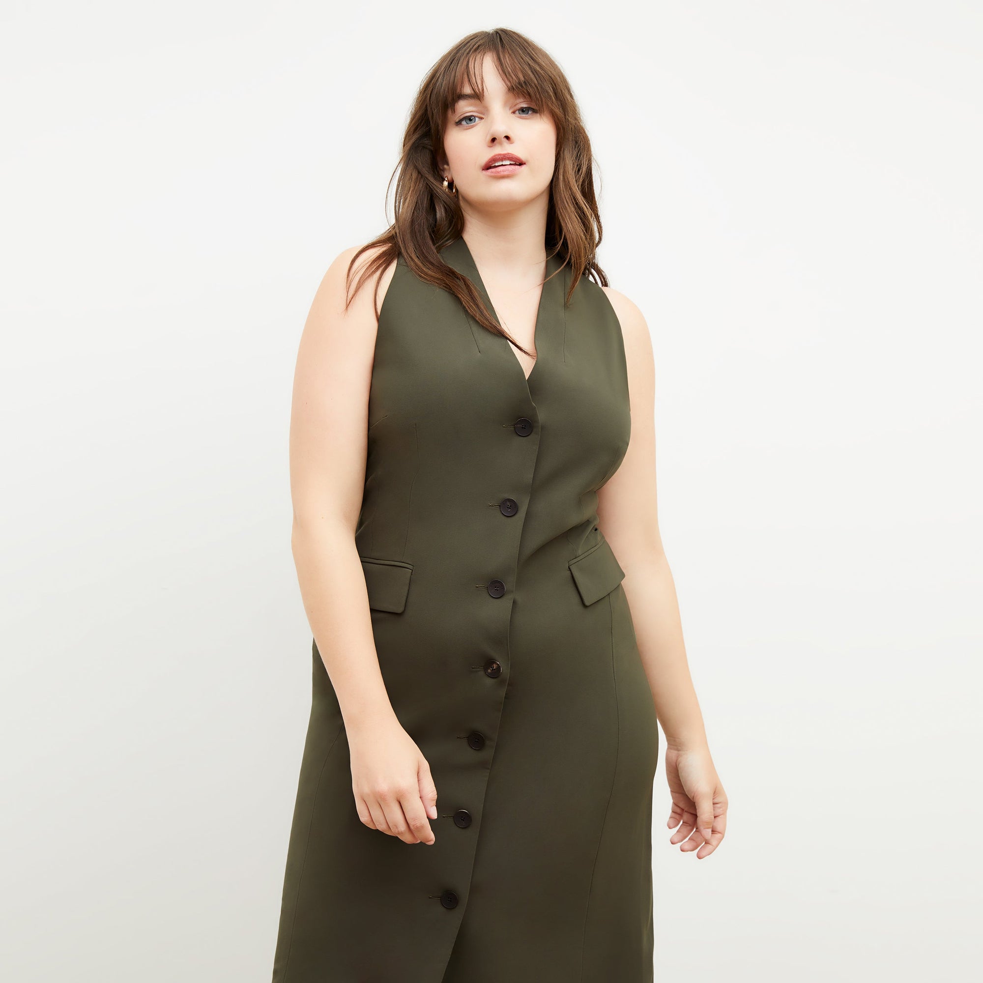 Back image of a woman wearing the Cassandra dress in origamitech in olive | Exclude