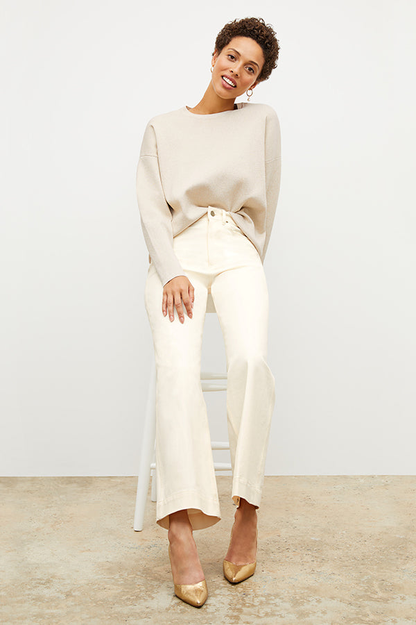 Front image of a woman standing wearing the milo jean in tusk | Exclude