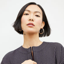 Front image of a woman wearing the tully top in black and white