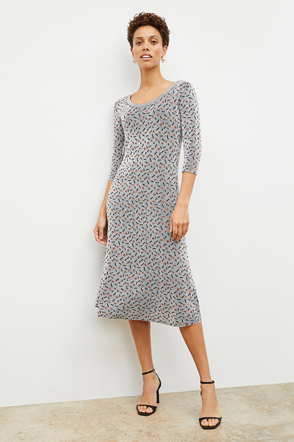 Front image of a woman wearing the Tippy Dress in Brick and Black | Exclude | Grid