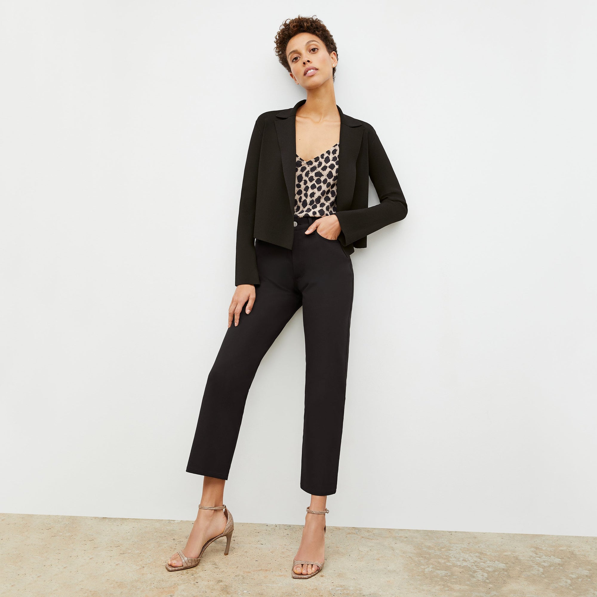 Front image of a woman standing wearing the Lisey Cami—Sahara Print Washable Silk in Tan/Black | Exclude