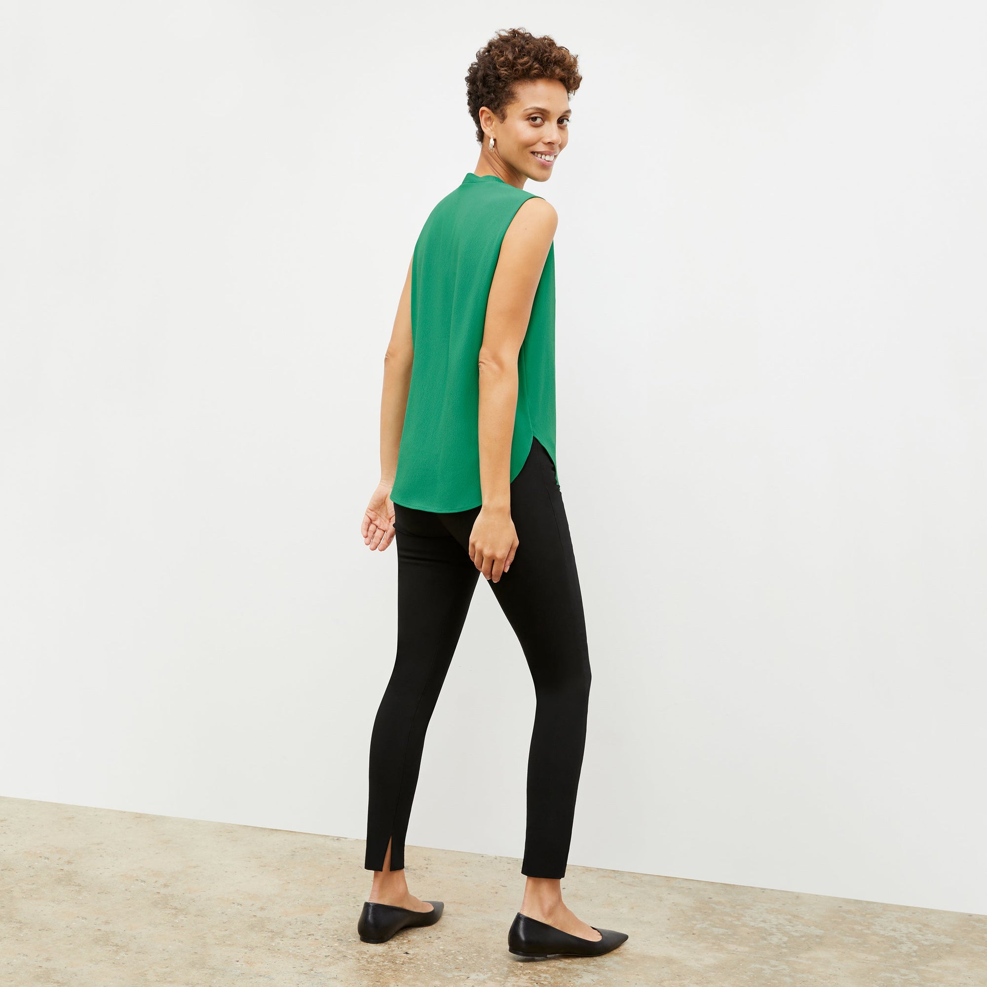 Back image of a woman wearing the skinny foster in black | Exclude