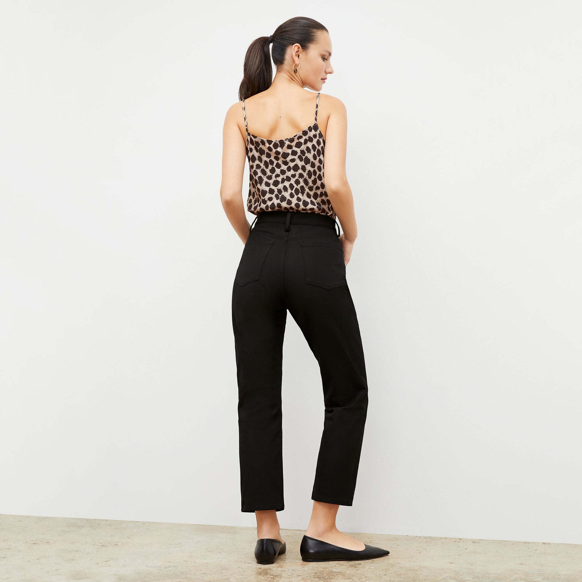 Front image of a woman standing wearing the Lisey Cami—Sahara Print Washable Silk in Tan/Black | Exclude