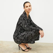 front image of a woman wearing the alyssa jacket in symphony print