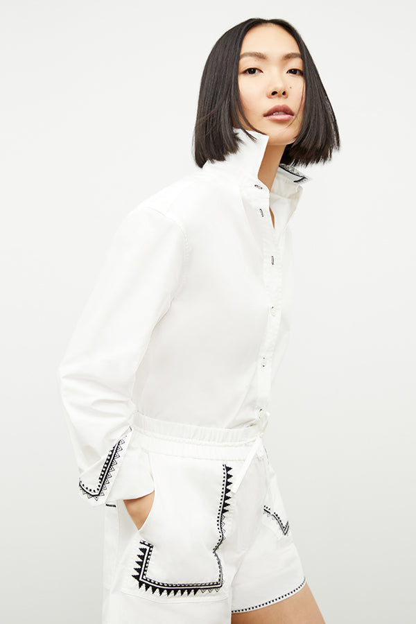 front image of a woman wearing the adina short in white | Exclude