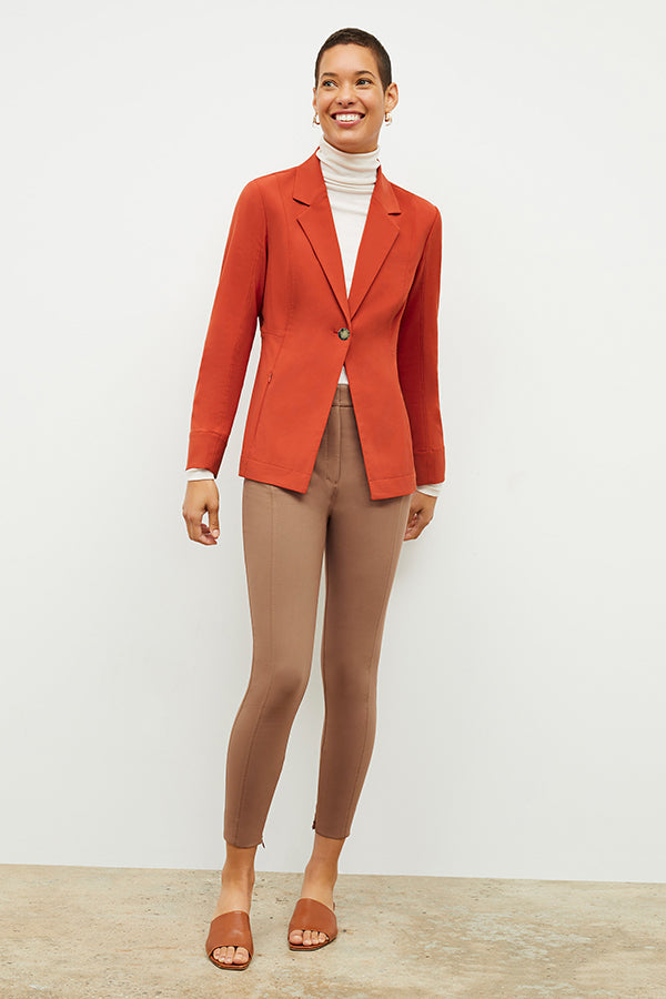 Front image of a woman standing wearing the Curie Pant—Everstretch in Saddle | Exclude