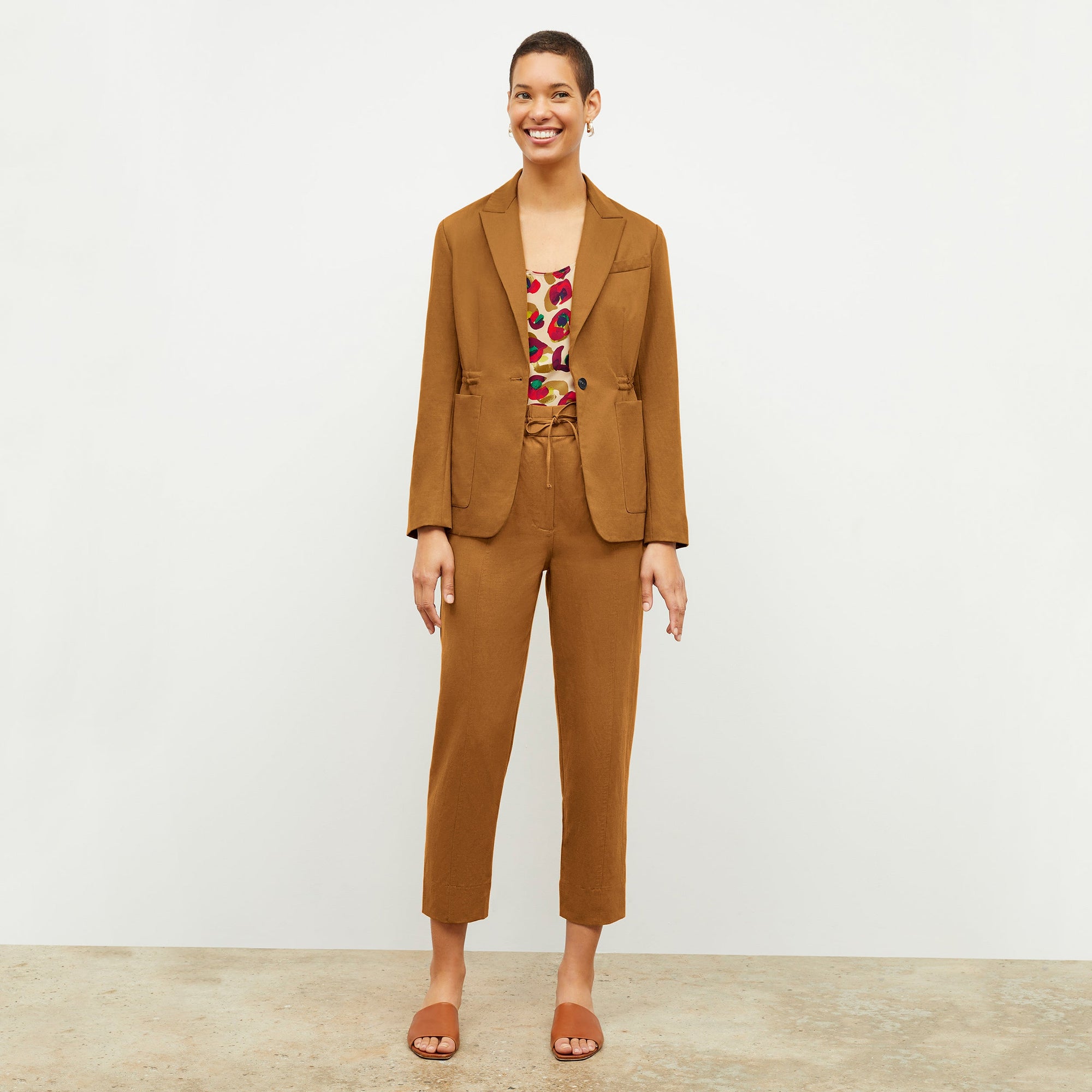 Front image of a woman wearing the Shane Pant in Acorn 