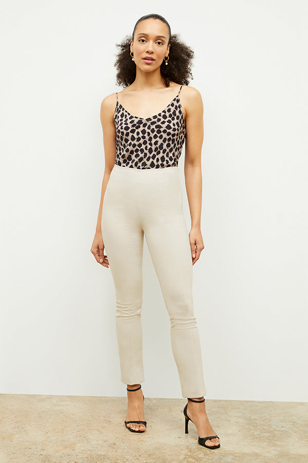 Front image of a woman standing wearing the Lisey Cami—Sahara Print Washable Silk in Tan/Black | Exclude