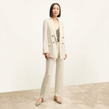 front image of a woman wearing the smith pant in champagne