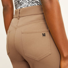 detail image of the M.M. LaFleur Logo on the back pocket of the jean