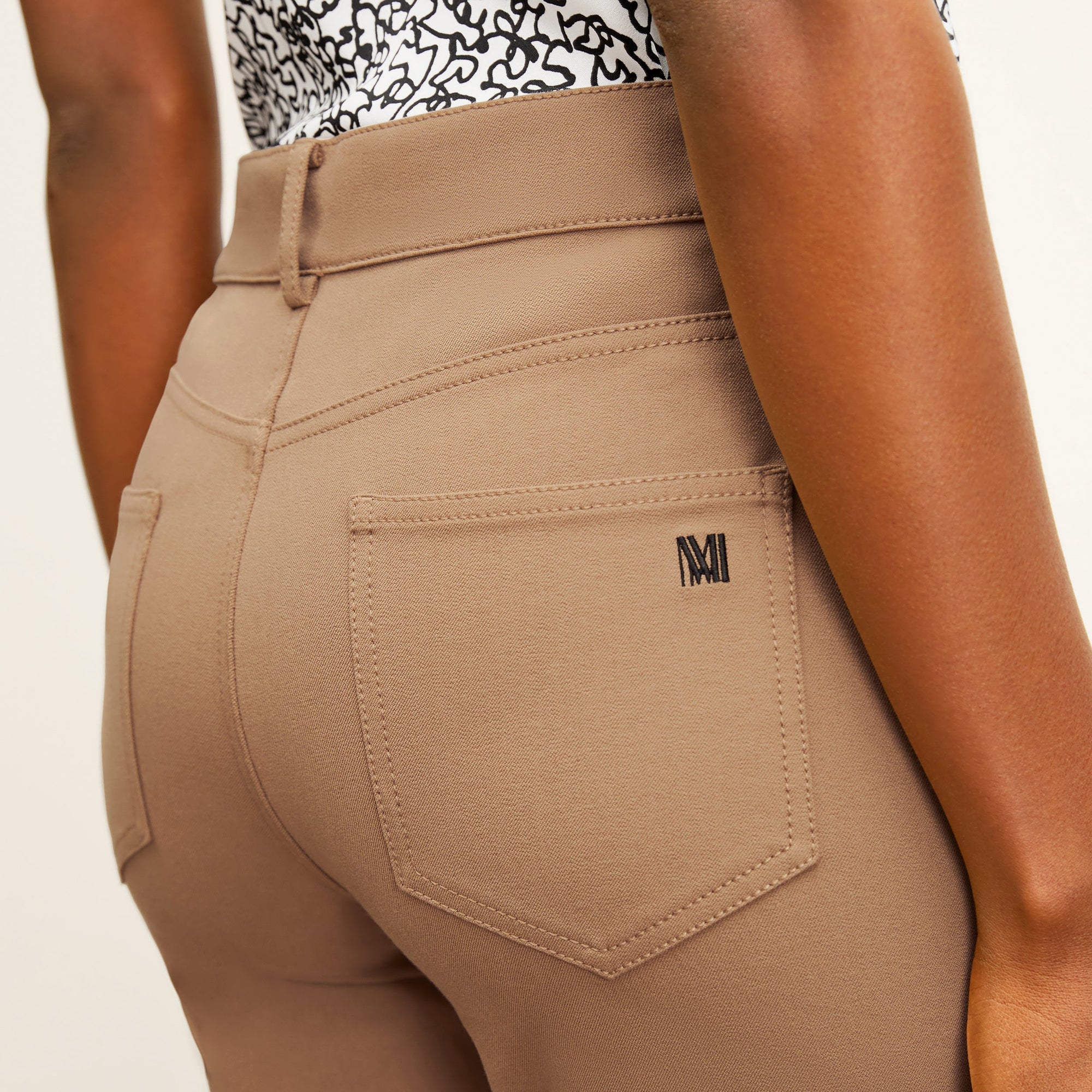 detail image of the M.M. LaFleur Logo on the back pocket of the jean