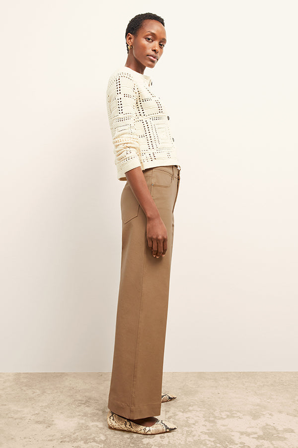 front image of a woman wearing the milo jean in saddle | Exclude | Grid Hover