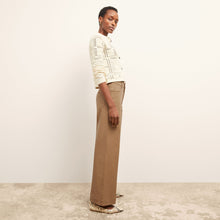 side image of a woman wearing the milo jean in saddle | Exclude