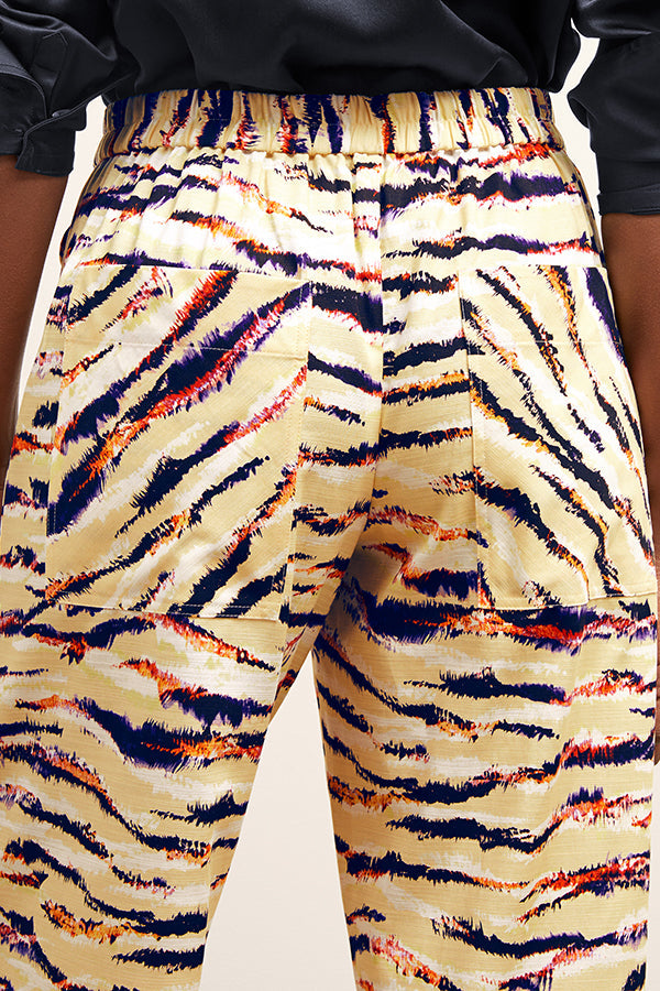 front image of a woman wearing the madelyn pant in savannah print | Exclude