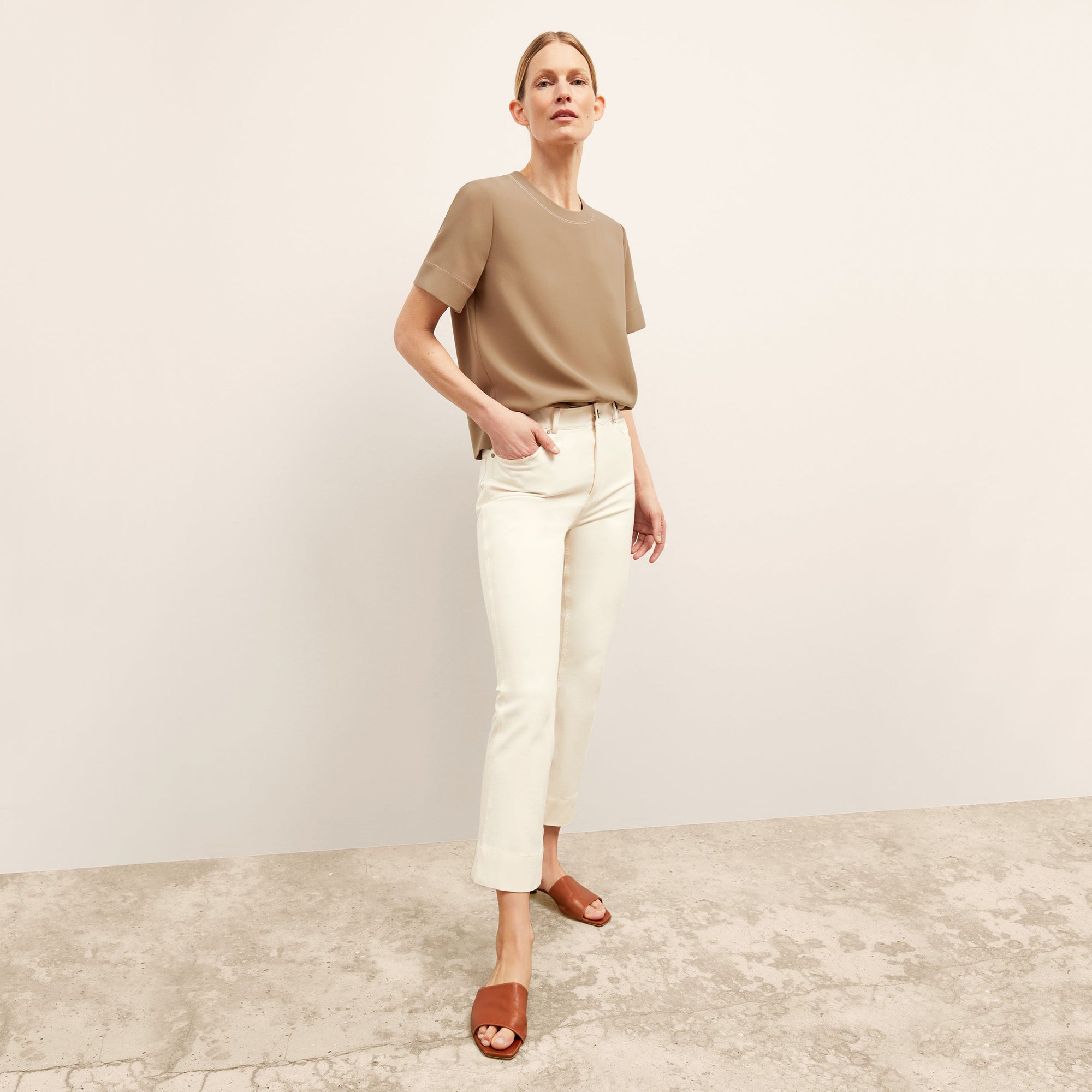 front image of a woman wearing the annika top in saddle