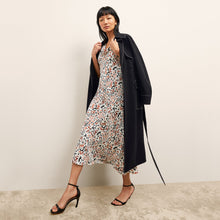 front image of a woman wearing the priya dress in leopard sketch