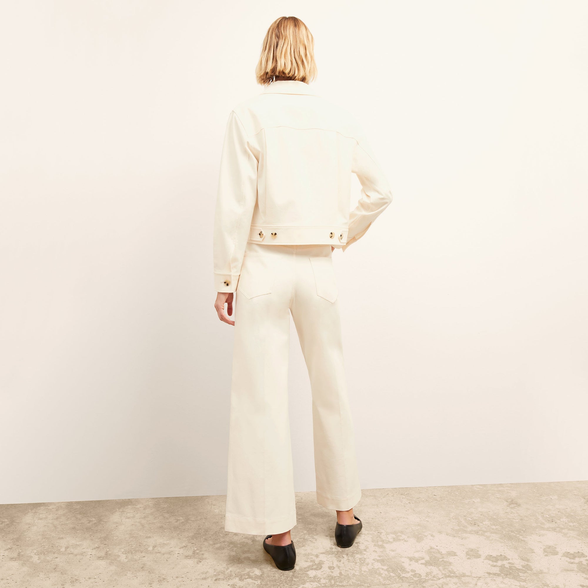 Back image of a woman wearing the Milo Jean in Tusk | Exclude