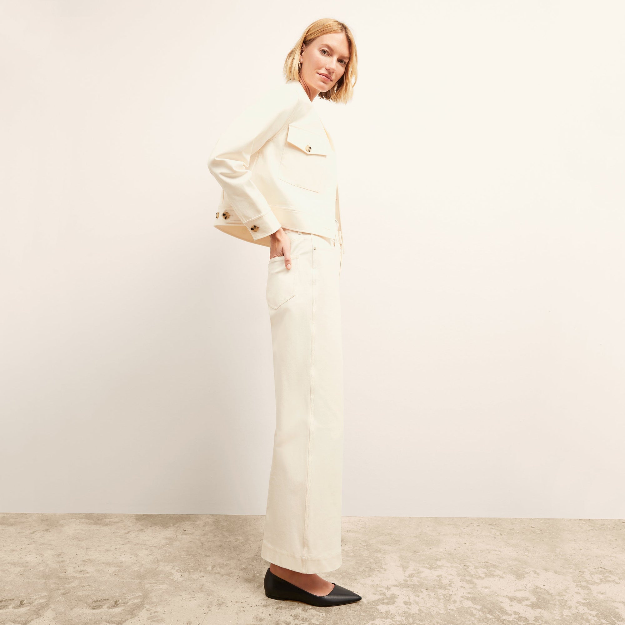 side image of a woman wearing the Milo Jean in Tusk | Exclude