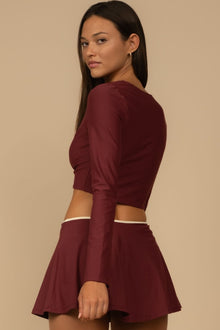 Maroon button-down cardigan with three-quarter sleeves and a fitted silhouette, shown from the back.