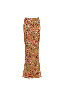 Maxi skirt with all-over multicolored floral print on gold background, fitted silhouette with slight flare at hem.
