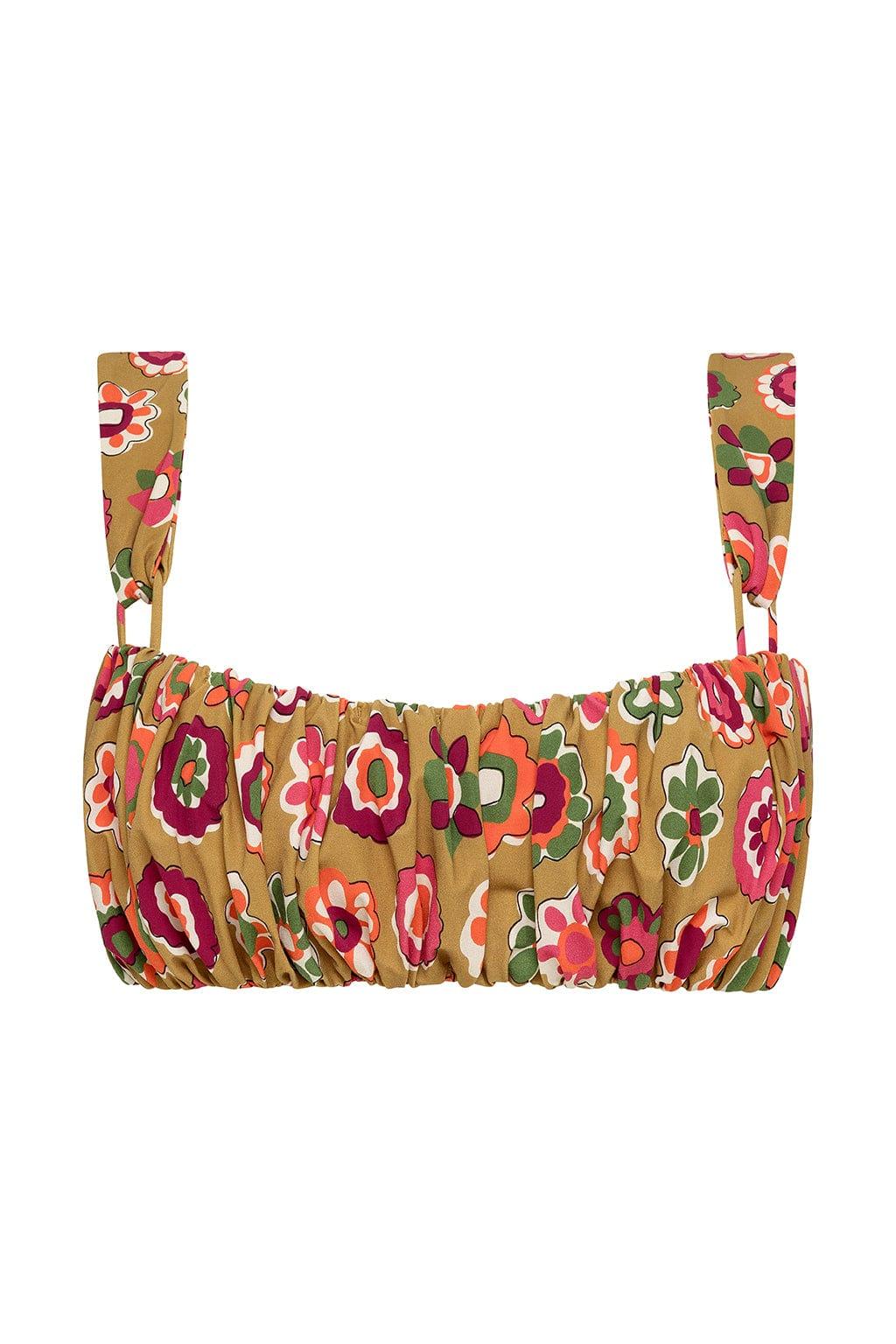 Tan bikini top with red, pink, orange, and green floral print, ruched front, and adjustable shoulder straps.