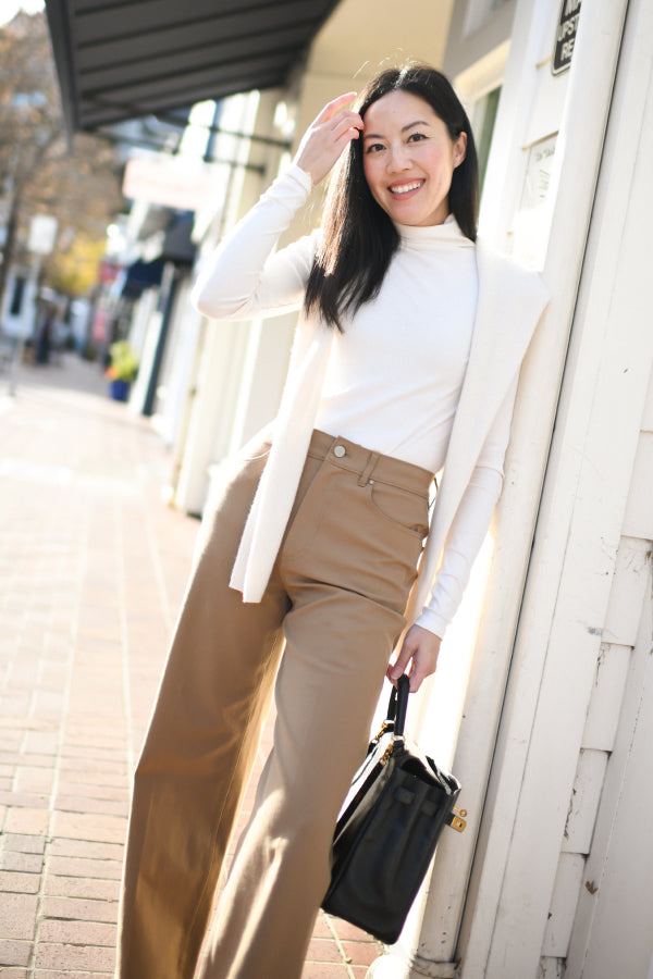 front image of anh wearing the milo jeans in saddle | Exclude
