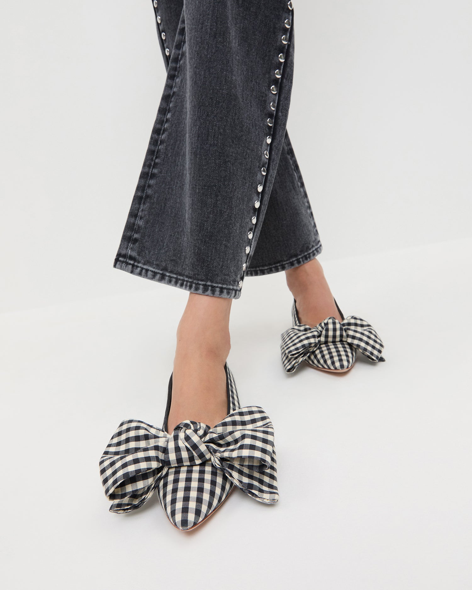 Noa Black/White Gingham Bow Flat in black/white gingham cotton and Winona Denim Pant in washed black denim with silver studs.