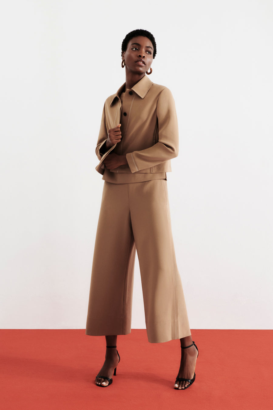 front image of a woman wearing the nicky jacket in saddle | Exclude