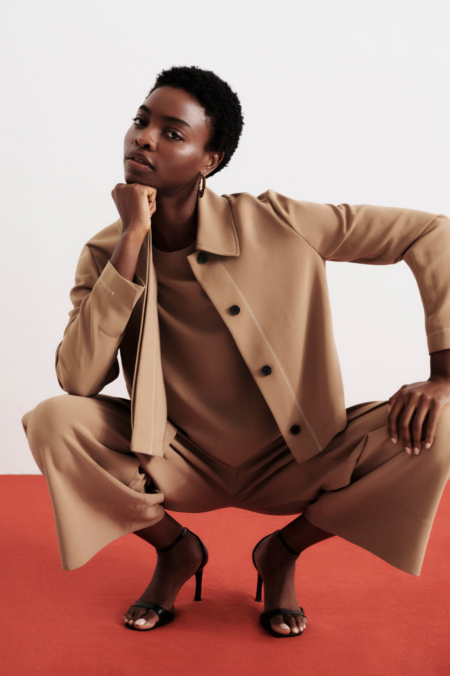 front image of a woman wearing the nicky jacket in saddle | Exclude